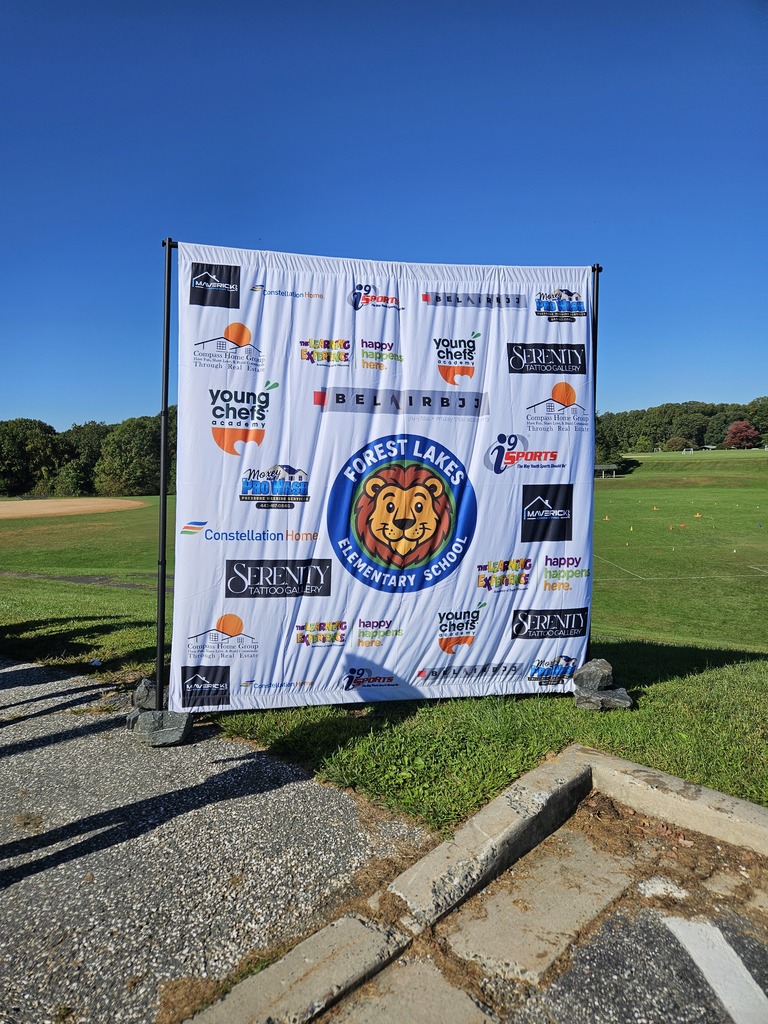 Leo picture in the center with sponsor names around the white sign