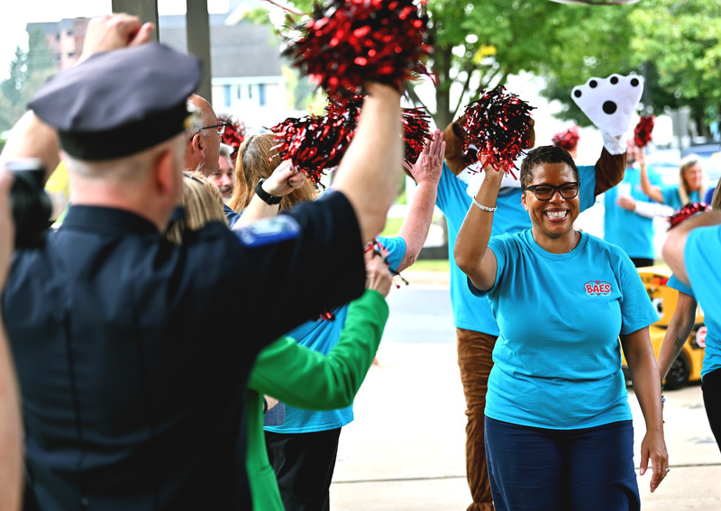 Dr. Mack cheering with other adults at Bel Air Elementary School