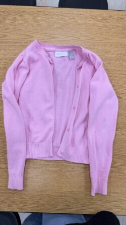 A collection of miscellaneous clothing items and cups in a variety of colors, styles, and sizes.