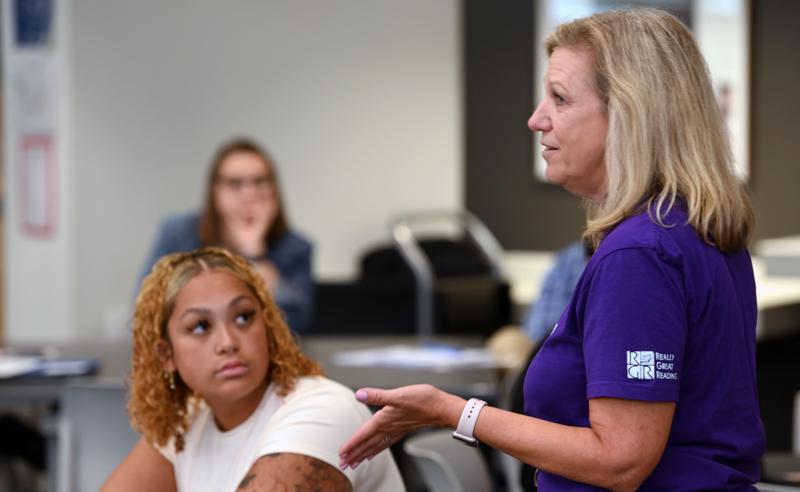 Senior teacher speaking to a group of new teachers