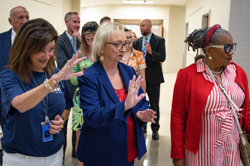 Dr. Gerringer and Dr. Wright waive at students