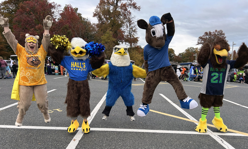 Five animal mascots jumping
