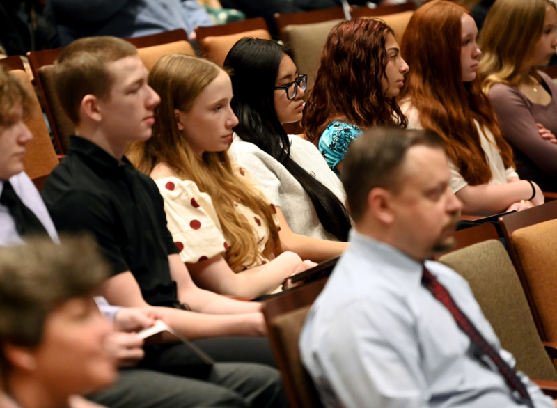 Students sitting in an auditorium listening to the Maryland Supreme Court Oral Arguments