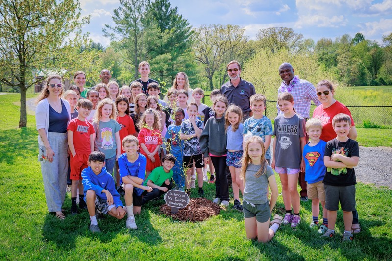 Group of student post smiling with their sapling