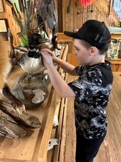 student with taxidermy duck