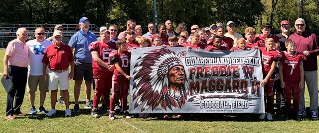 Former teammates and current Cumberland Middle School Football Team members and others join Freddie Maggard for the celebration of naming the field after him in honor of his tremendous athletic success. 