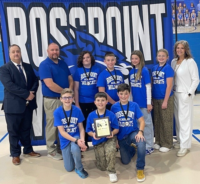 The Sixth Grade Showcase Champions Rosspoint team members are shown here. First row, left to right, Levi Hensley, Nolan Simpson and Brandon Zakk Collins; second row, Superintendent Brett Johnson, Principal Needham Saylor, Dalton Williams, Zach Napier, Sadie Huckleby, Adeline Childress and Coach Malissa Lewis.