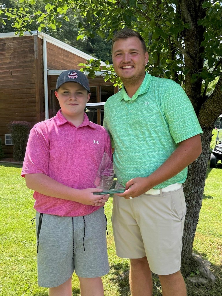Mason is shown with assistant coach Brett Widner. 
