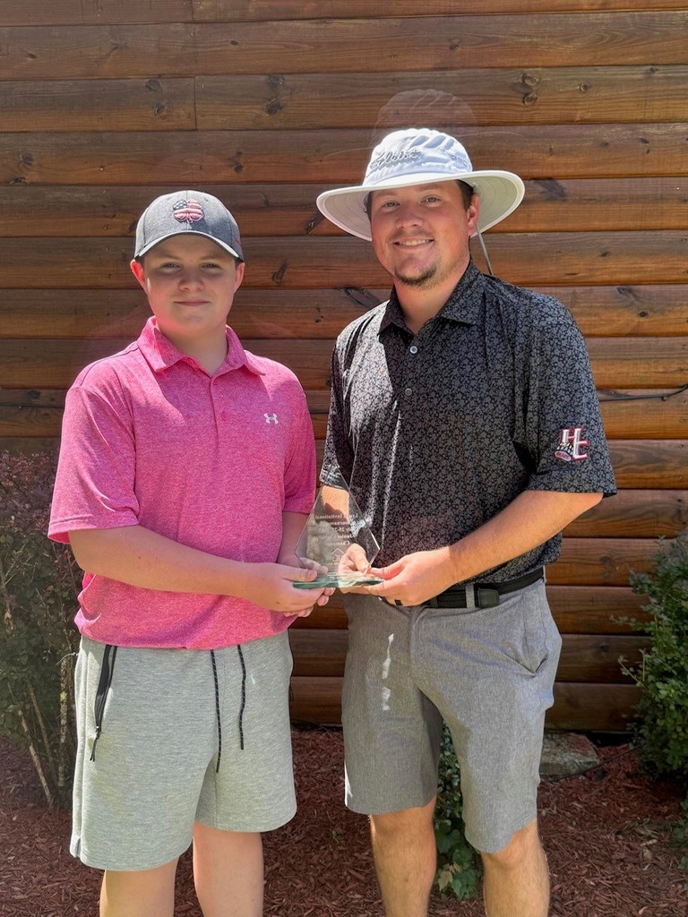 Mason is shown with Coach Brendan Rutherford.