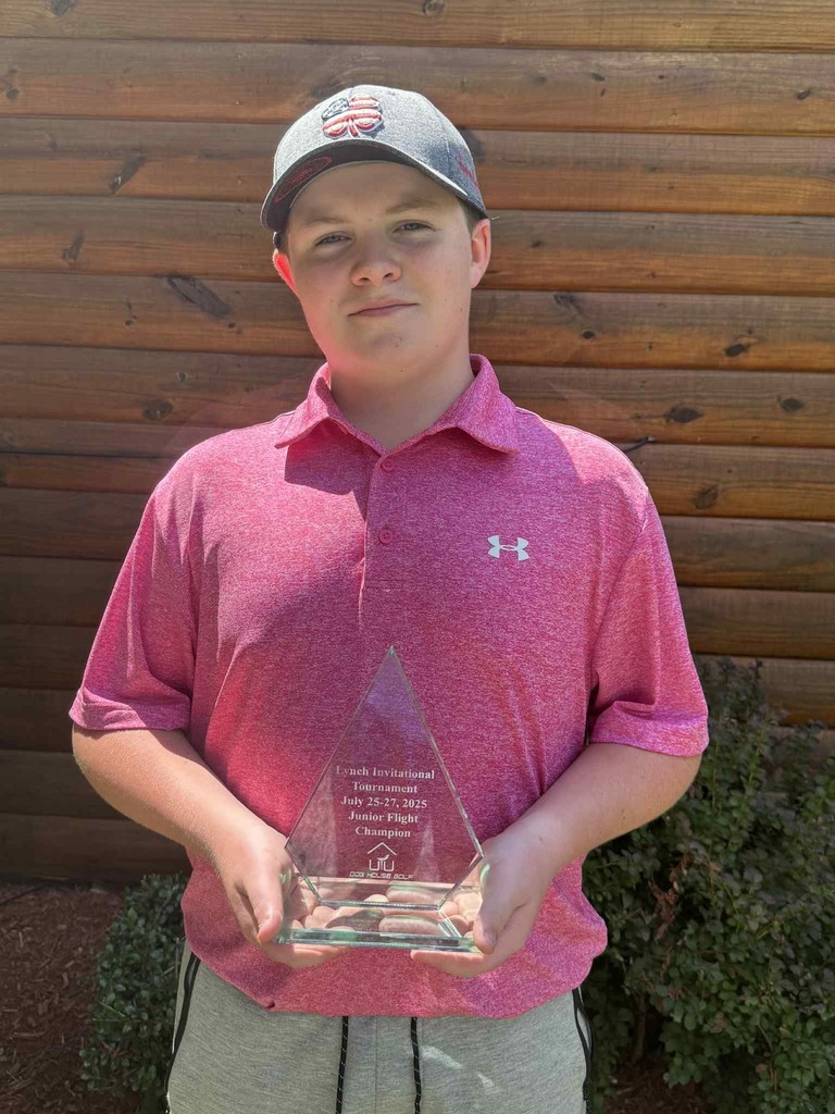 Mason Garrett displays his award for winning top honors in the Lynch junior golf tournament. 