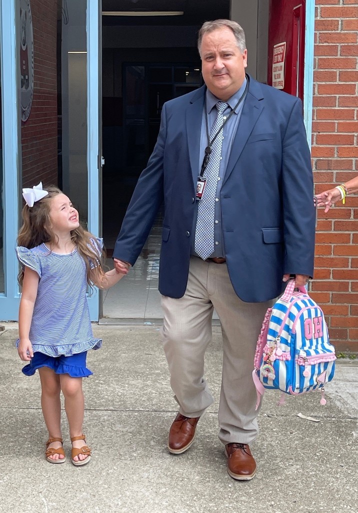 Superintendent Brett Johnson with his granddaughter, Oaklee, as he picks her up from her day at the Early Childhood Learning Center. 
