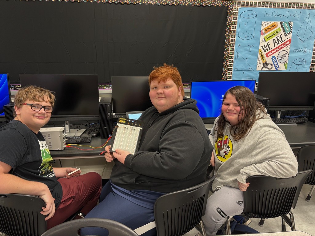 Students in Mrs. Rich’s Engineering 2 class are seen building electrical circuits on breadboards.