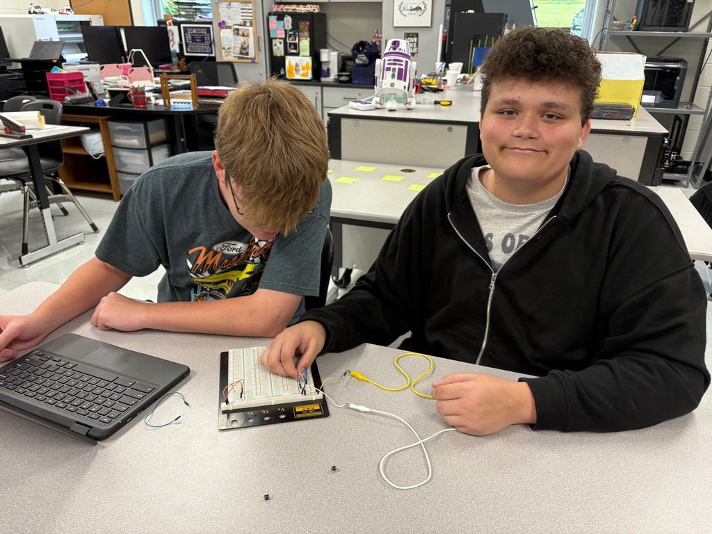 Students in Mrs. Rich’s Engineering 2 class are seen building electrical circuits on breadboards.