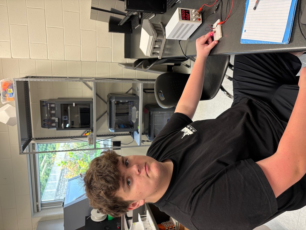 Students in Mrs. Rich’s Engineering 2 class are seen building electrical circuits on breadboards.