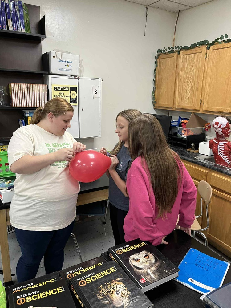 6th grade is demonstrating Newtons 3rd law motion using balloon rockets.