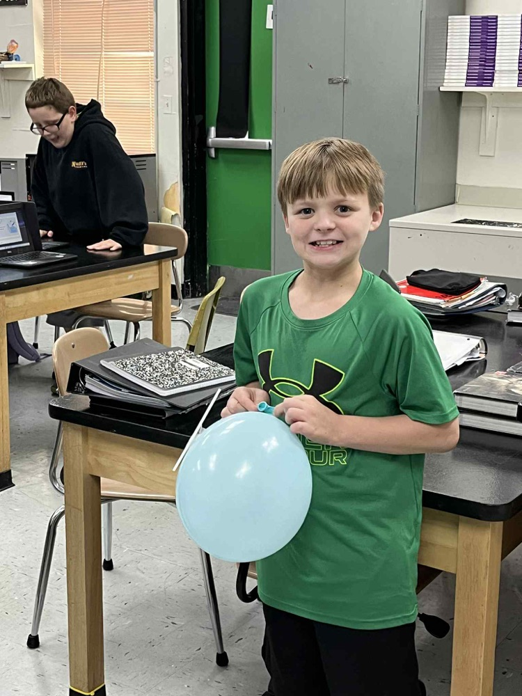 6th grade is demonstrating Newtons 3rd law motion using balloon rockets.