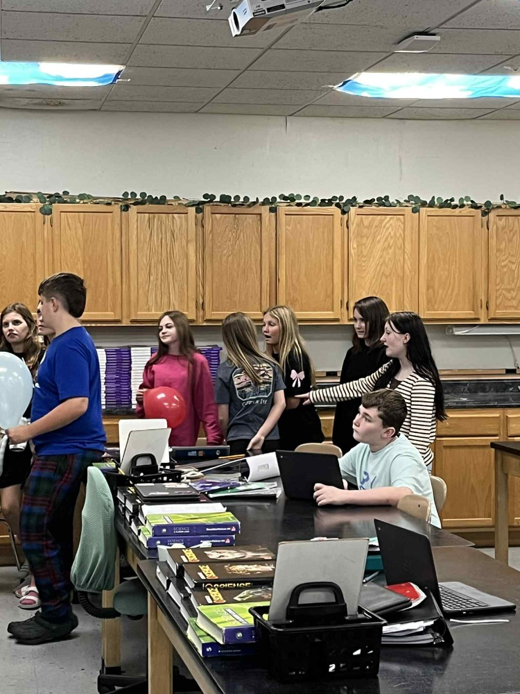 6th grade is demonstrating Newtons 3rd law motion using balloon rockets.