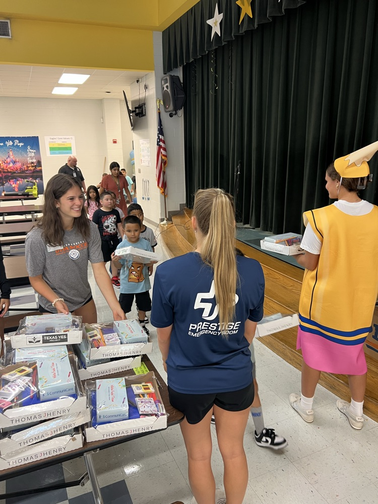 students receive school supplies