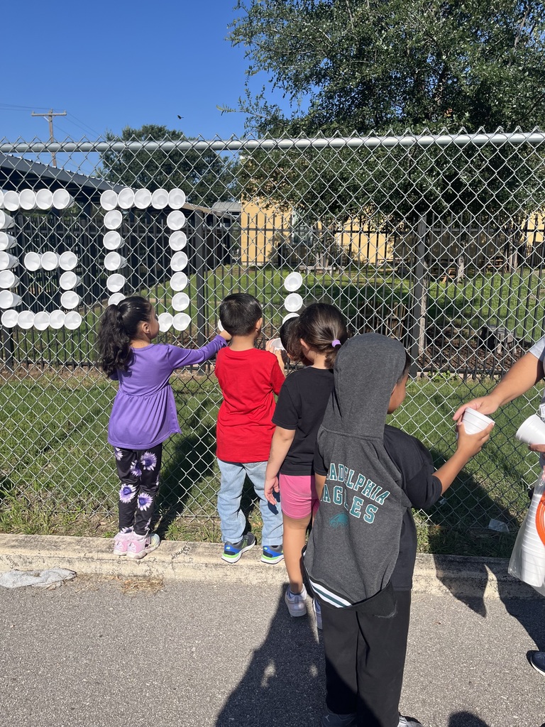 PREK STUDENT WORKING ON SIGN