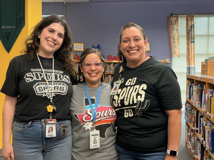 teachers in Spurs gear