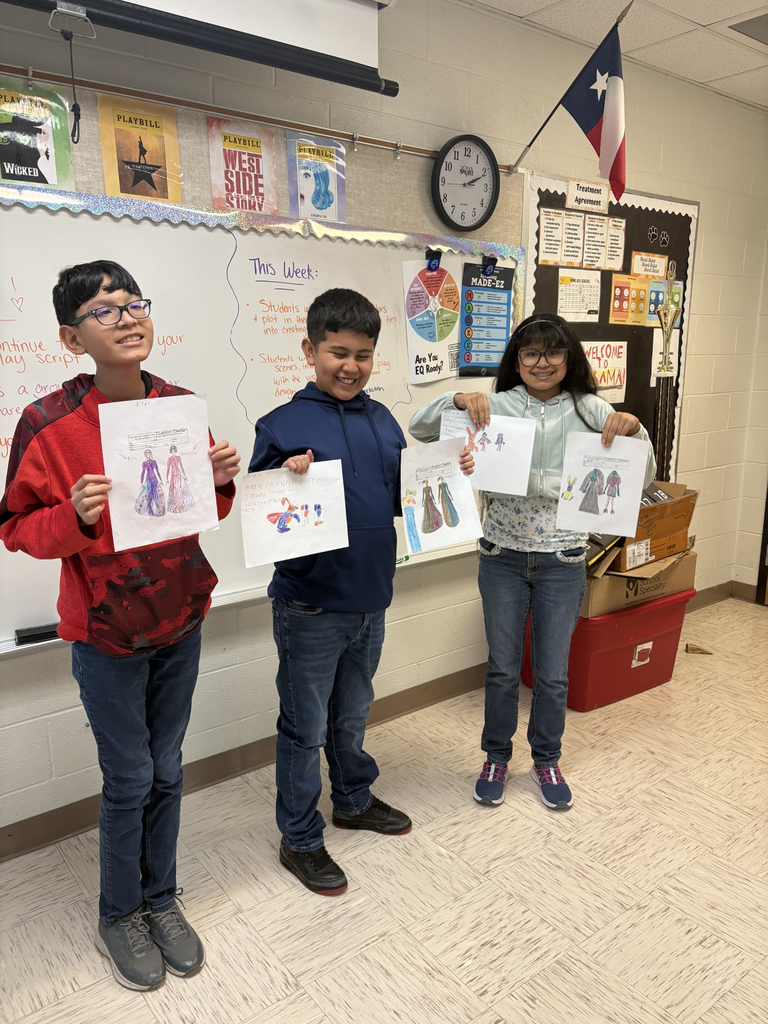 Students displaying their costumes designs