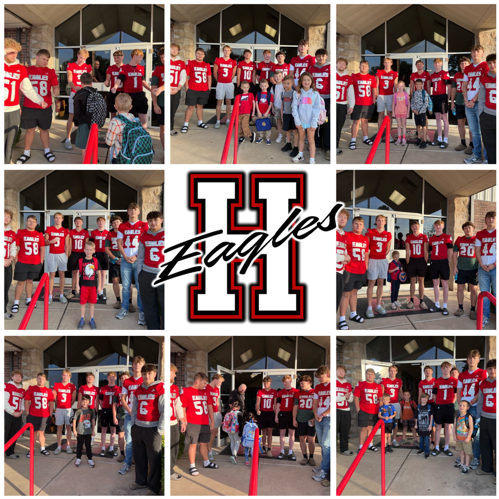 Elementary Students greeting the football players. 