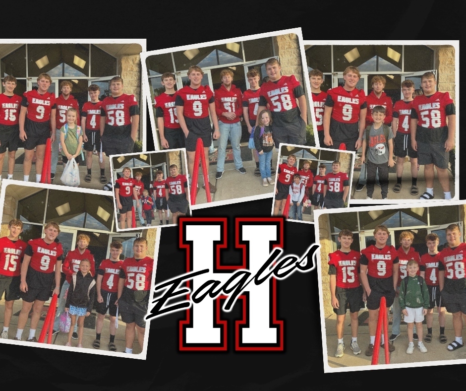 Football Players greet elementary Students