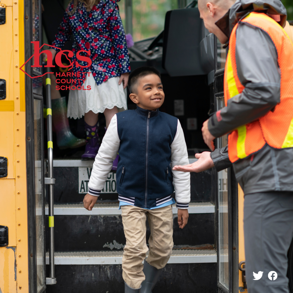 student getting off the bus