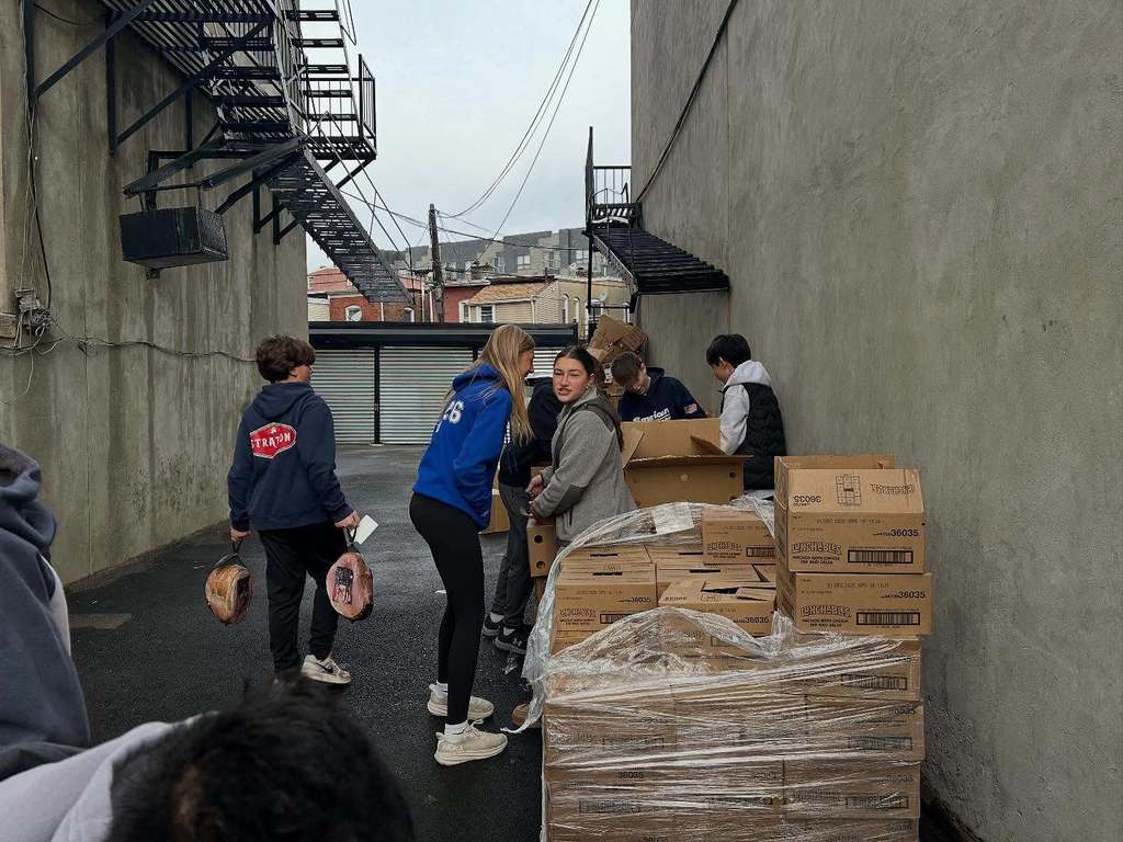 Students at The Apostles' House serving Thanksgiving Meals.