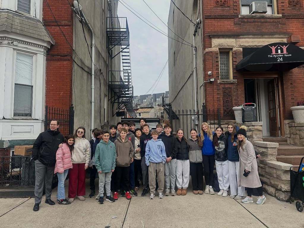 Students at The Apostles' House serving Thanksgiving Meals.