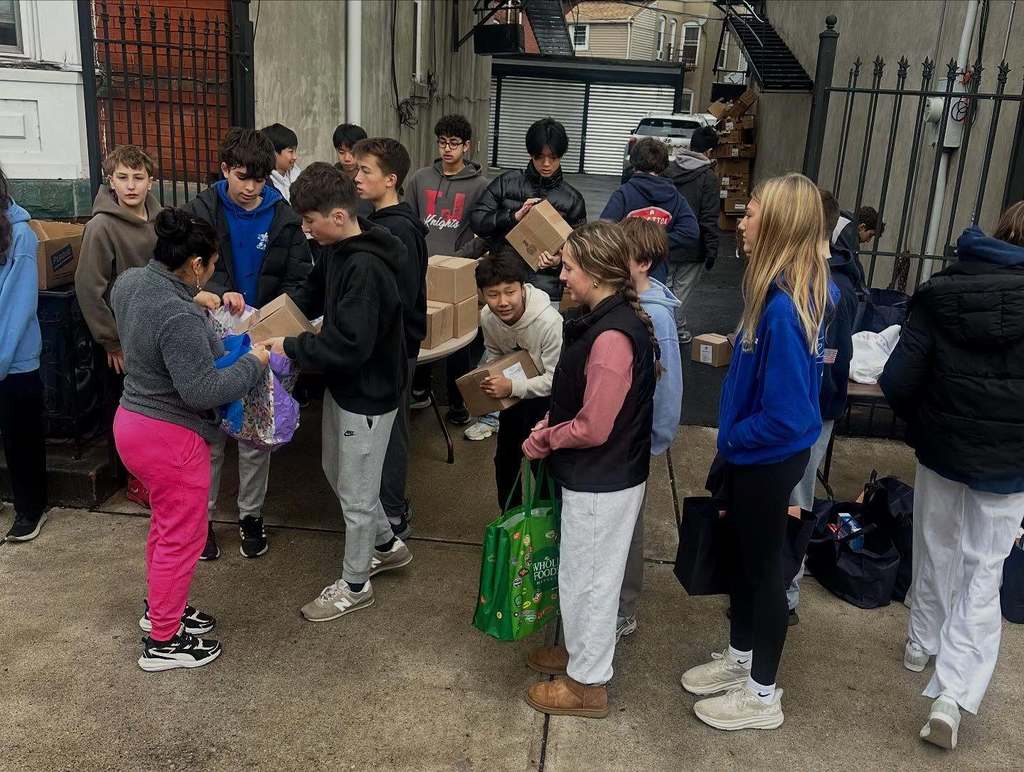 Students at The Apostles' House serving Thanksgiving Meals.