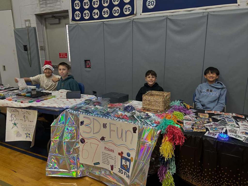Students pose with their entrepreneurial projects that they sell at the TREPS Marketplace.