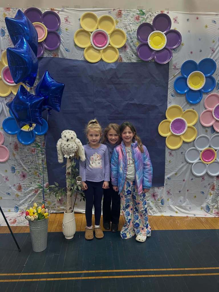 Students smile at the Art Show