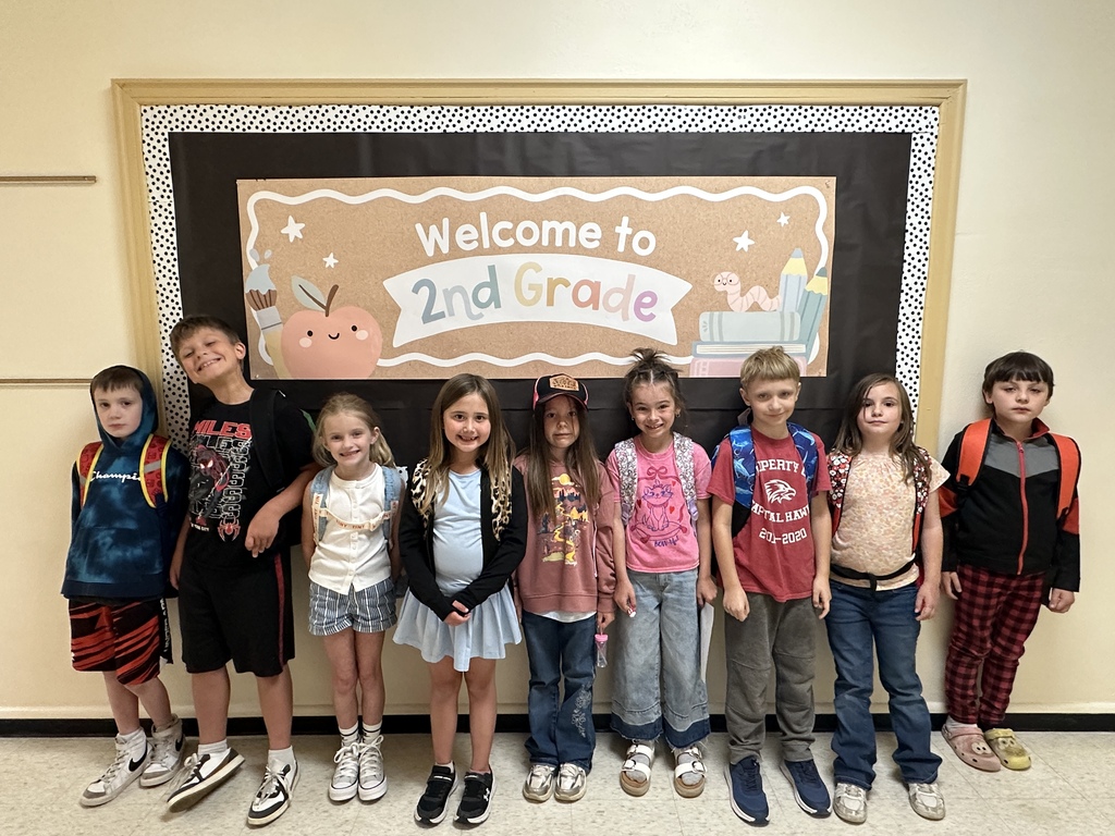 2nd grade class students outside classroom.