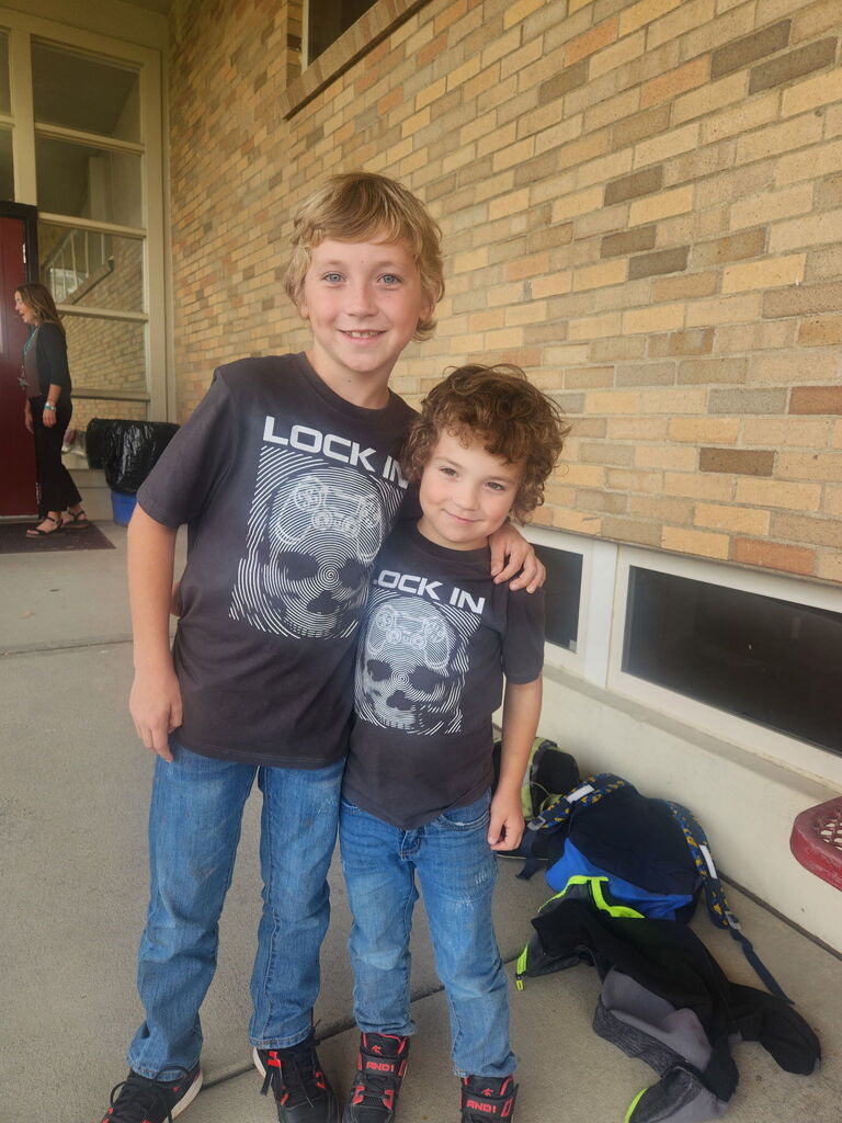 two children wearing the same tshirt
