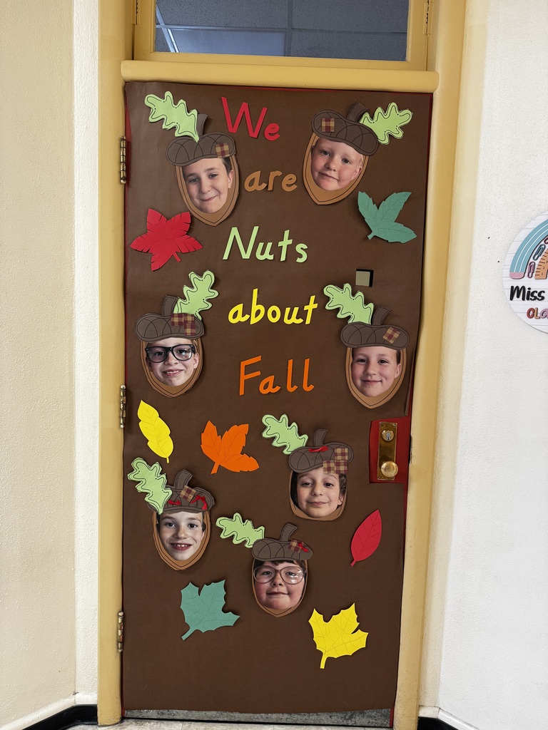 elementary door with kids faces as acorns.