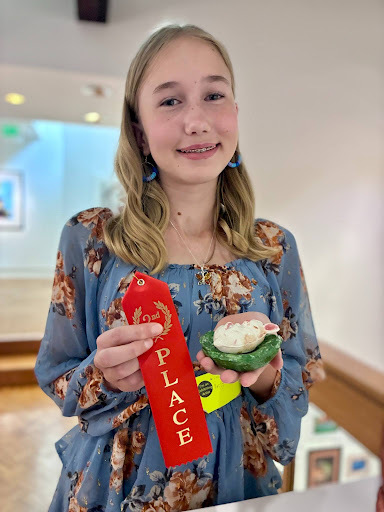 Paris Faulkner 6th grader at Creekside Intermediate receiving 2nd place for her Ceramic Art.