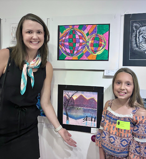 Susan Banks poses with her art student, Lynlee McHale, a fourth grader from New Mountain Hill Elementary, who earned a Merit Award for her drawing.