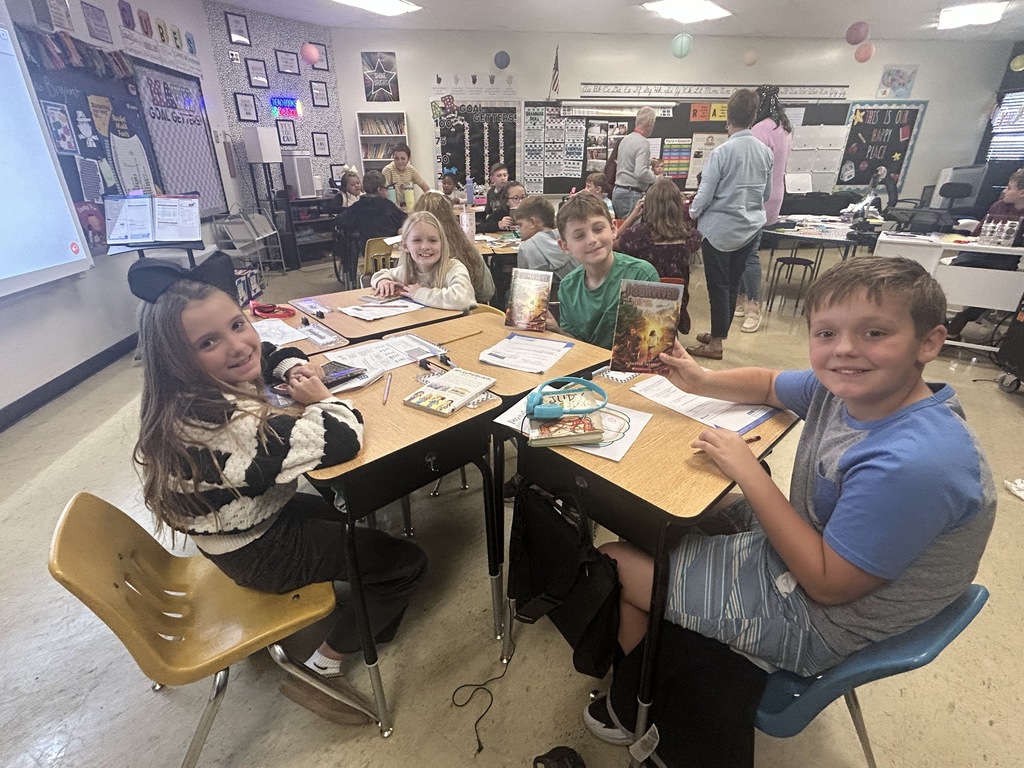 students receiving kiwanas books