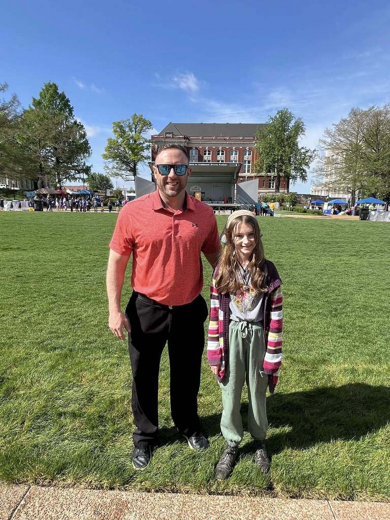 5th grade student with principal