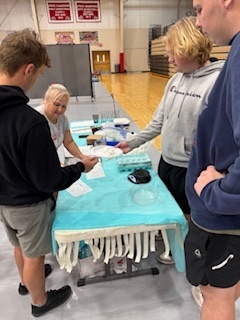 Teams weighing in their egg drop enclosures