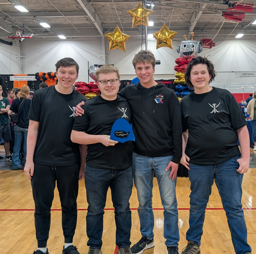 Robotics Team holding award