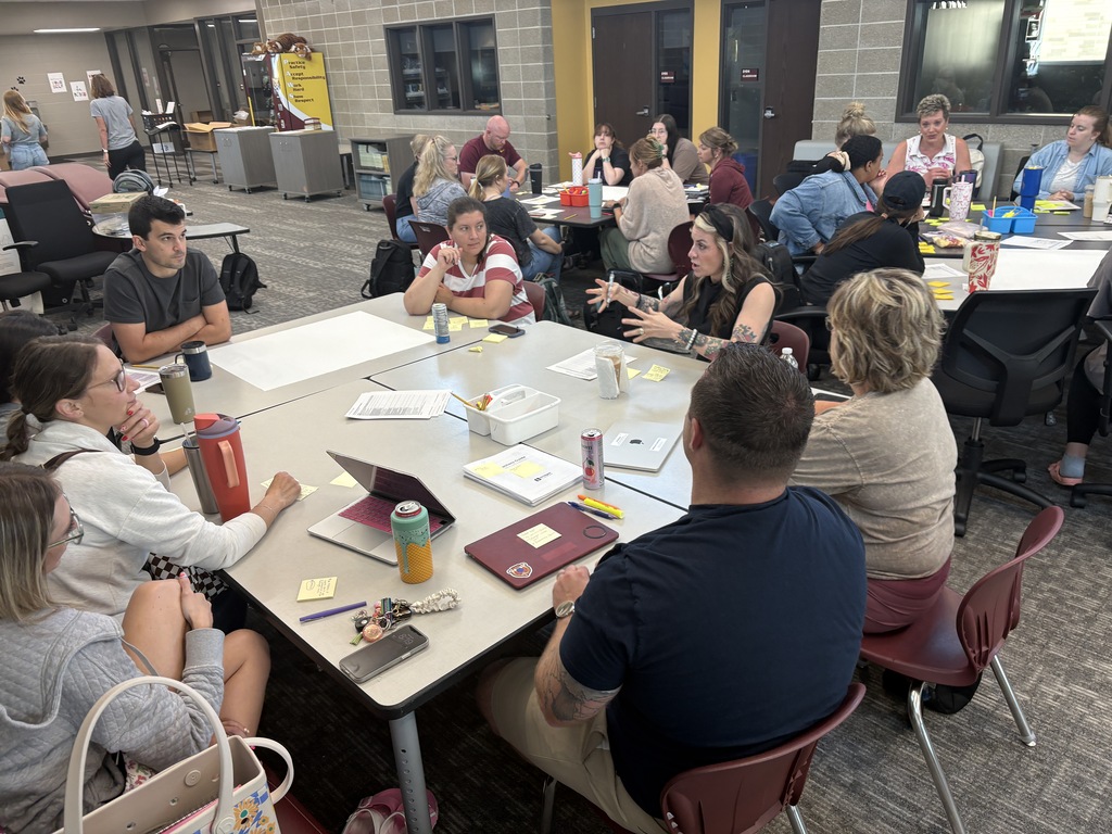 elementary teachers reviewing math curriculum