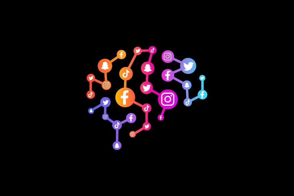 Outline of a brain made from connected social media icons including Facebook, Twitter, Instagram, TikTok, and Snapchat.