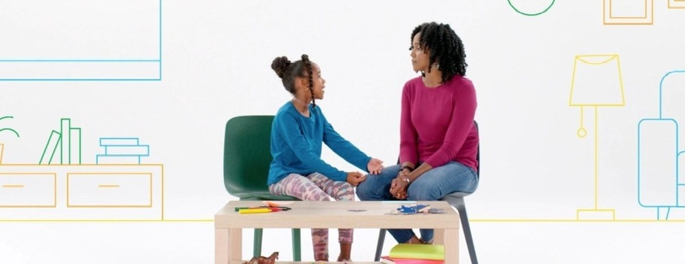 mother and child sitting together talking
