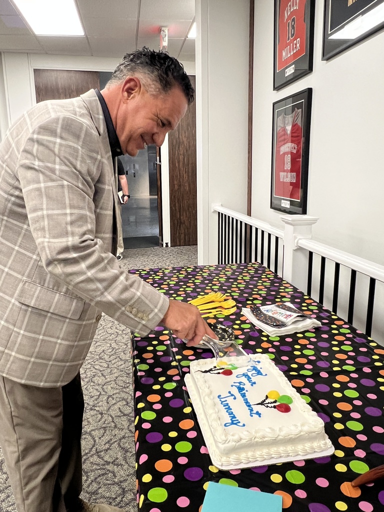 Jimmy Lopez cuts his retirement cake.
