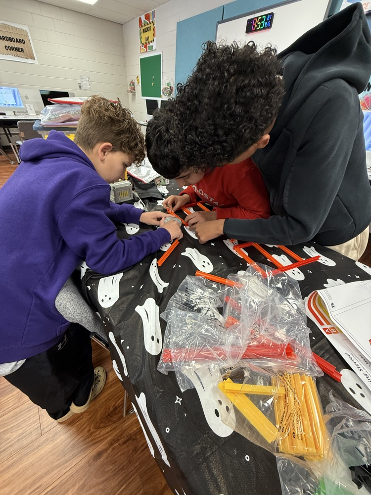 students putting together the structure 