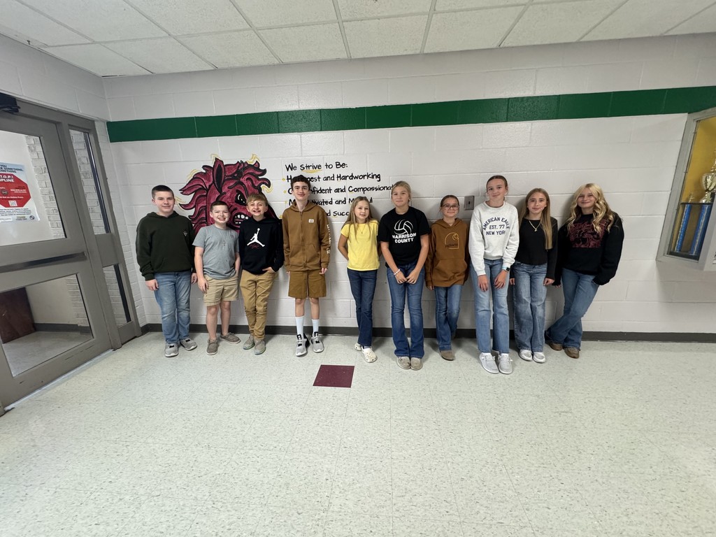 a group of students standing in a hallway