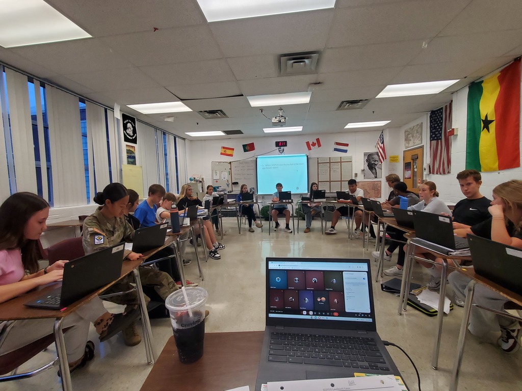 Ms Duff's honors government students participating in a fishbowl discussion on SCOTUS landmark cases.