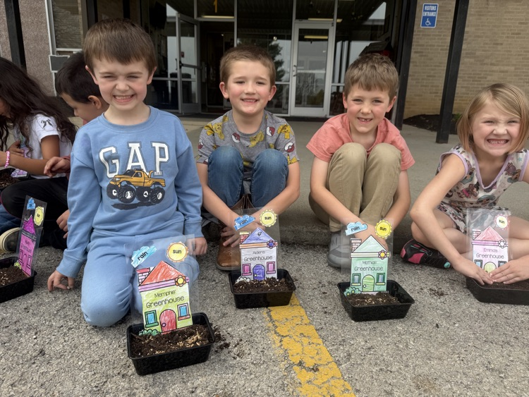 students planting grass seed 